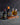 Two bottles of Watkins bitters next to a cold drink