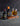 Two bottles of Watkins bitters next to a cold drink
